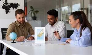 Professionals discussing documents in a modern office meeting, collaborative job search or career planning concept
