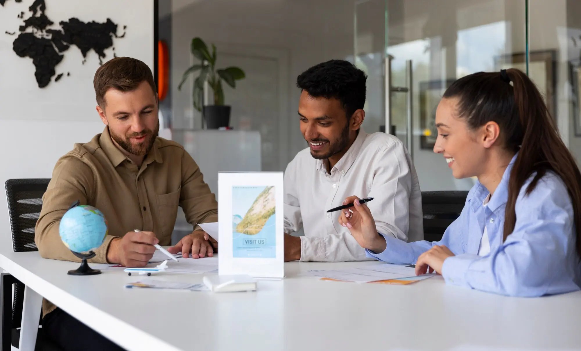 Professionals discussing documents in a modern office meeting, collaborative job search or career planning concept